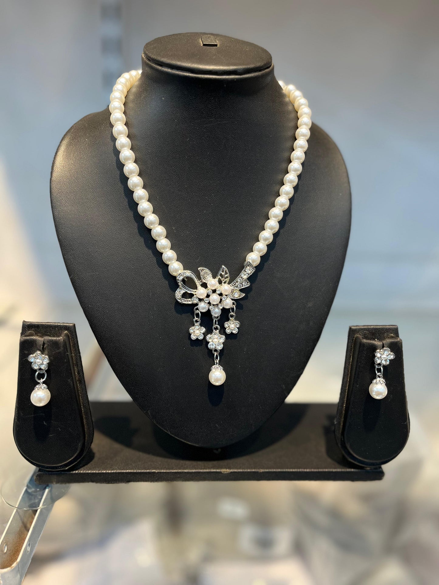 Elegant Pearl and Crystal Floral Necklace and Earring Set Silver