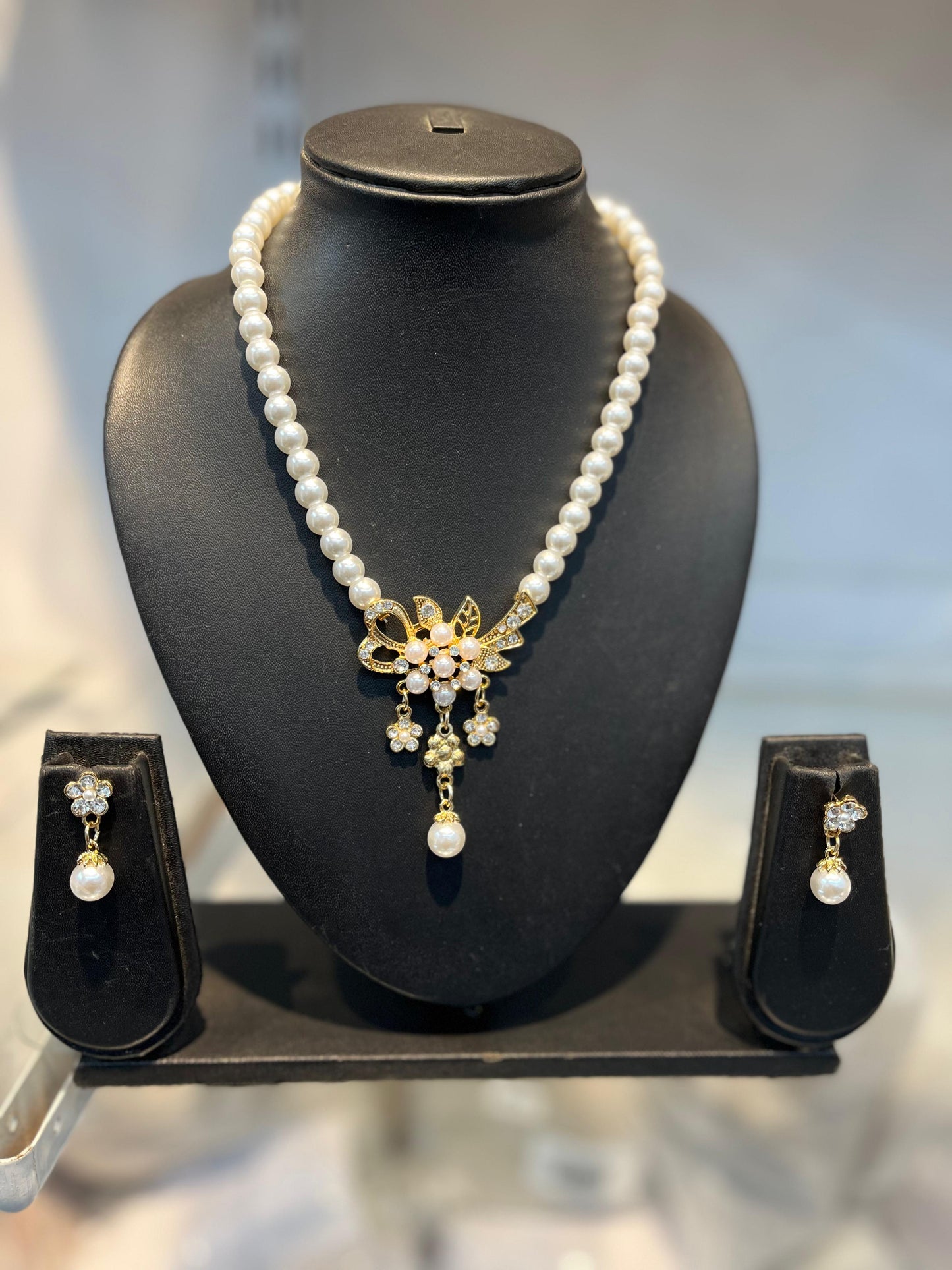 Elegant Pearl and Crystal Floral Necklace and Earring Set Golden